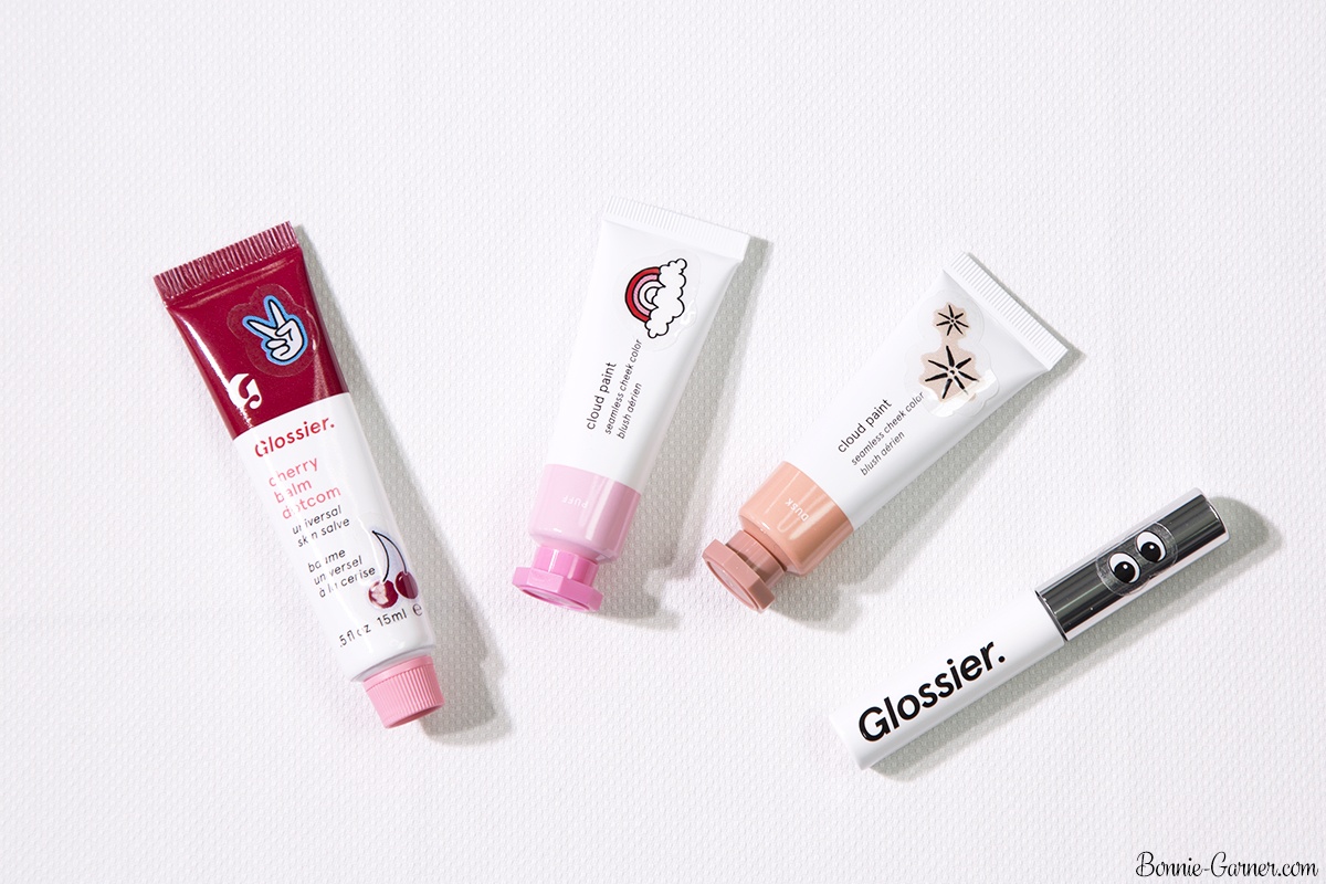 Glossier: Cloud Paint Dusk, Puff; Balm Dotcom Cherry; Boy Brow Brown