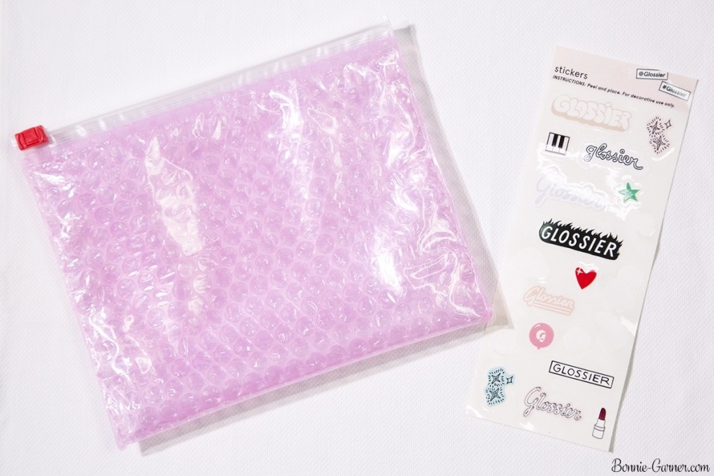 Glossier: pink bag, stickers